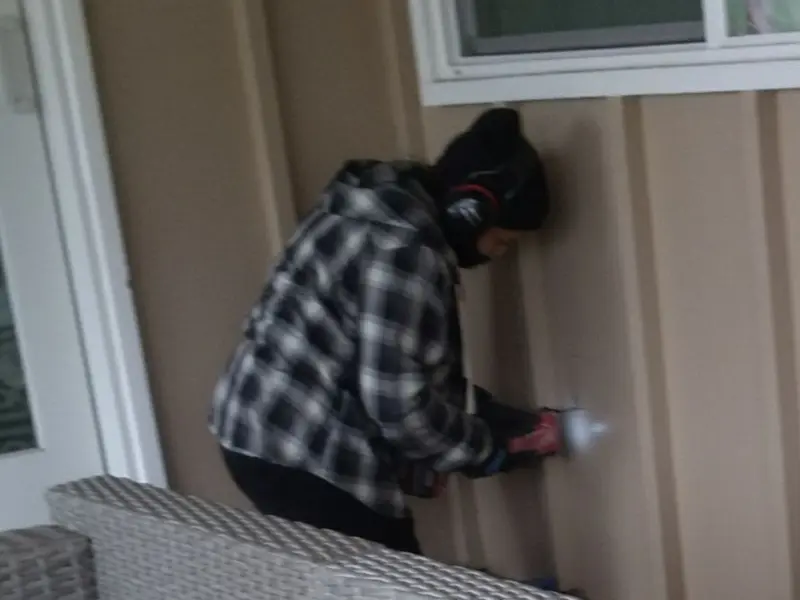Professional electrician installing an exterior outlet in Crossett